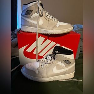 Tan and white Jordan mids